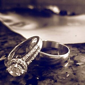 Improve Your Marriage with Your Actions wedding rings sitting on table next to divorce papers