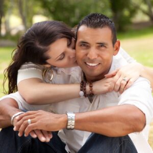 Affectionate happy couple expressing positive feelings towards one another in the Park