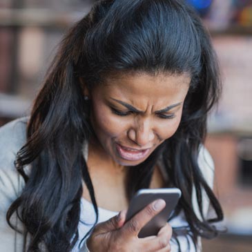 mother reading a passive aggressive text from her spouse about their children