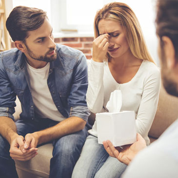 couple in counseling session talking about infidelity in their relationship