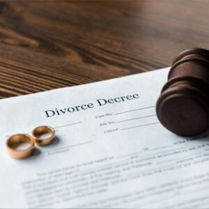 divorce paperwork and couples wedding rings