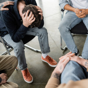 bob telling his story of emotional abuse in group counseling