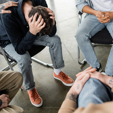 bob telling his story of emotional abuse in group counseling